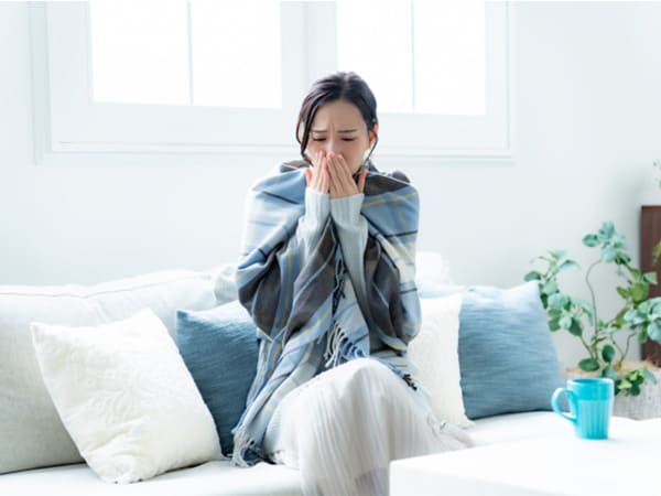 体調不良の女性